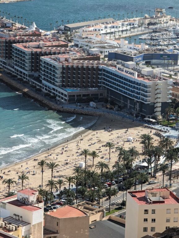 An aerial view of a beach and a city